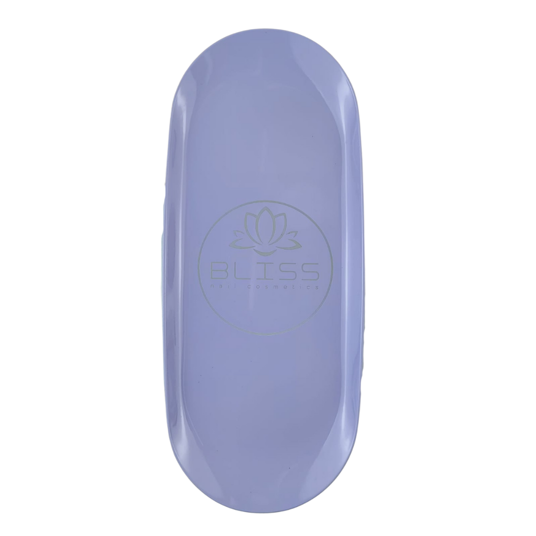 Bliss, la marque dédiée aux prothésistes ongulaires vous propose son plateau oval de couleur mauve. Gardez votre espace de travail propre !